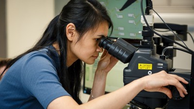 woman work at microscope
